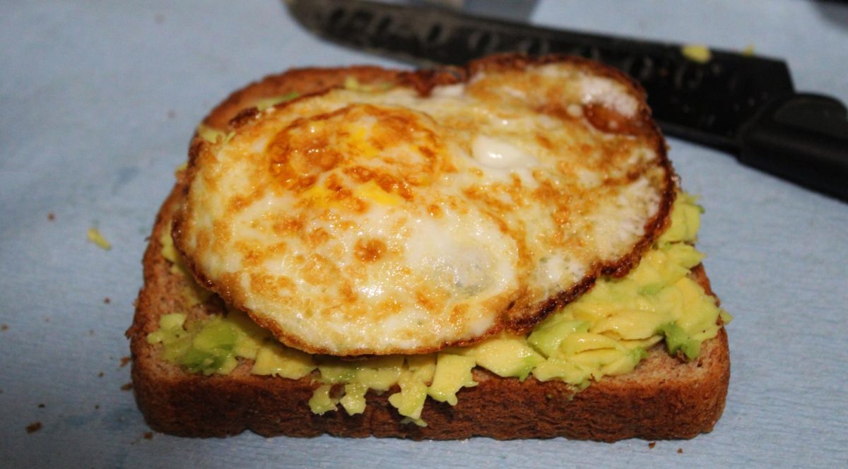 Once the egg has been added, the toast is ready to enjoy.