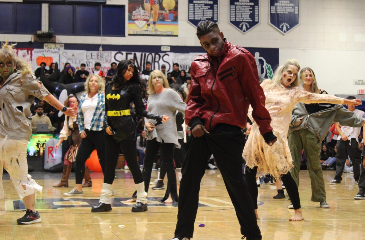 Venom dance team with teachers and staff amazes attendees with their rendition of Thriller by Michael Jackson. 
