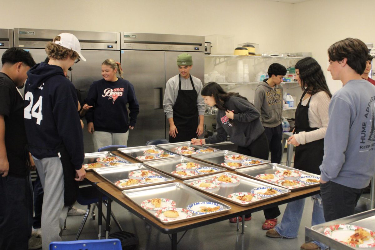 BHS culinary students plate their pizzas before they are delivered to judges on Dec. 14. 