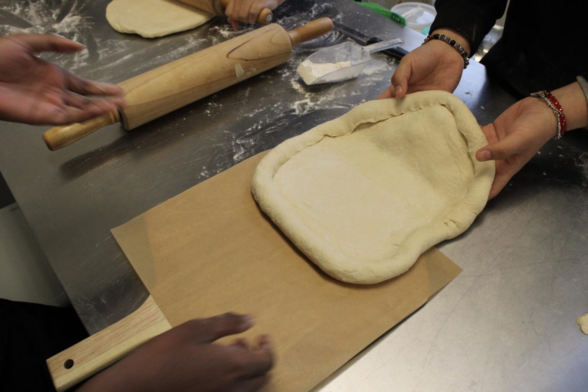 BHS culinary students prepare their pizza for the Pizza Palooza competition on Dec. 14.