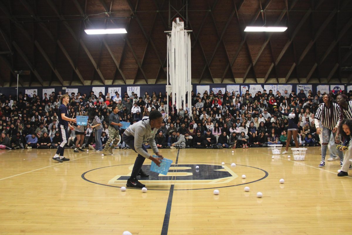 Drillers compete in a snowball toss rally game.
