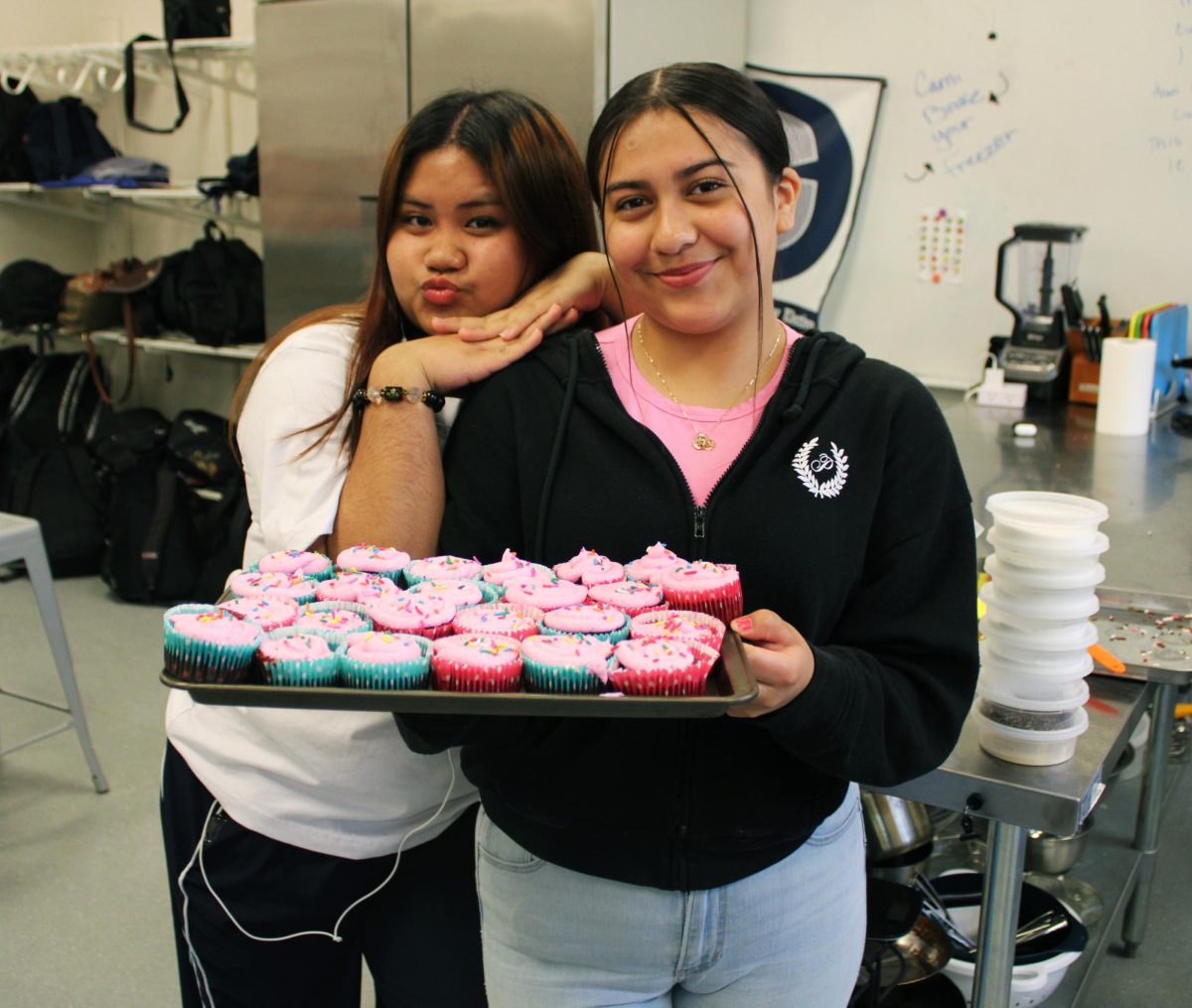 Students finish preparing their cupcakes.