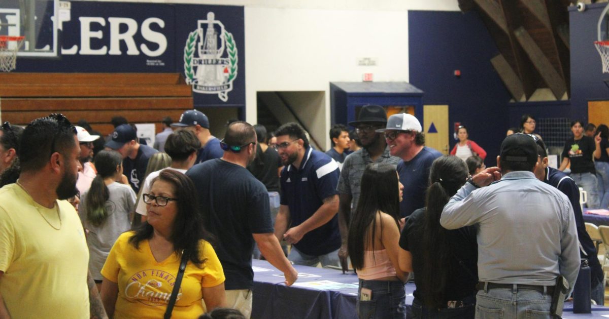 Driller staff greet students and their families.