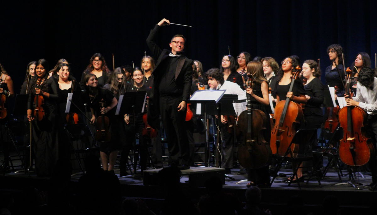 Randy Bennett, BHS music teacher, celebrates the end of the performance.