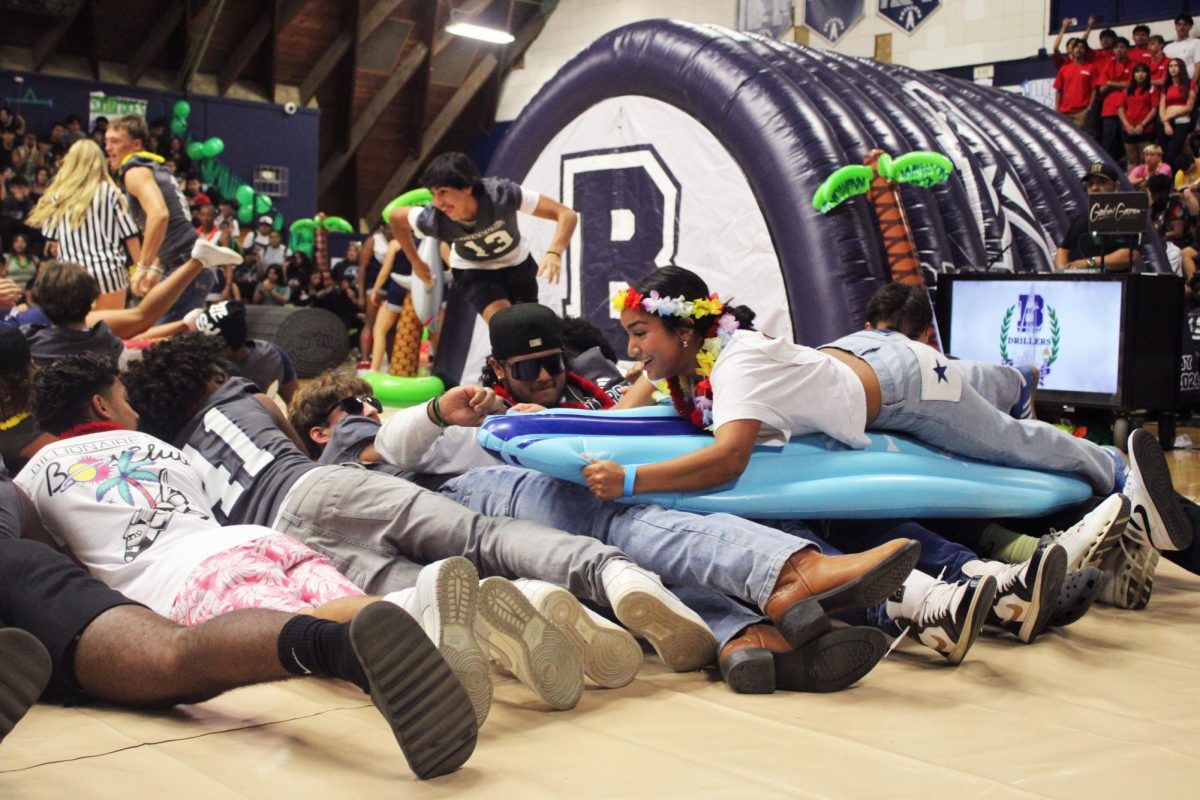 Drillers participate in the surfboard game.