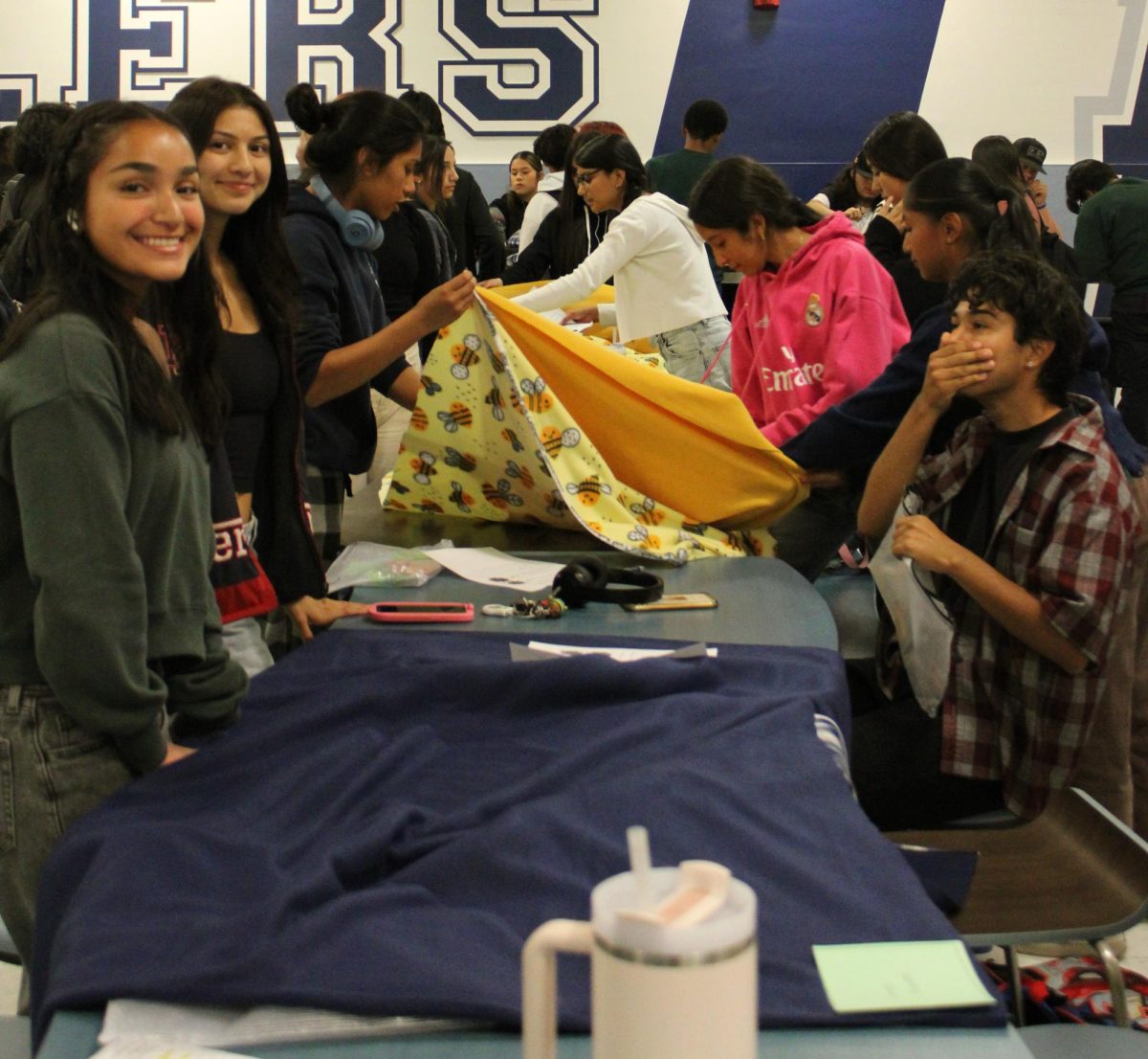 Drillers work together to make and pack blankets for distribution. 