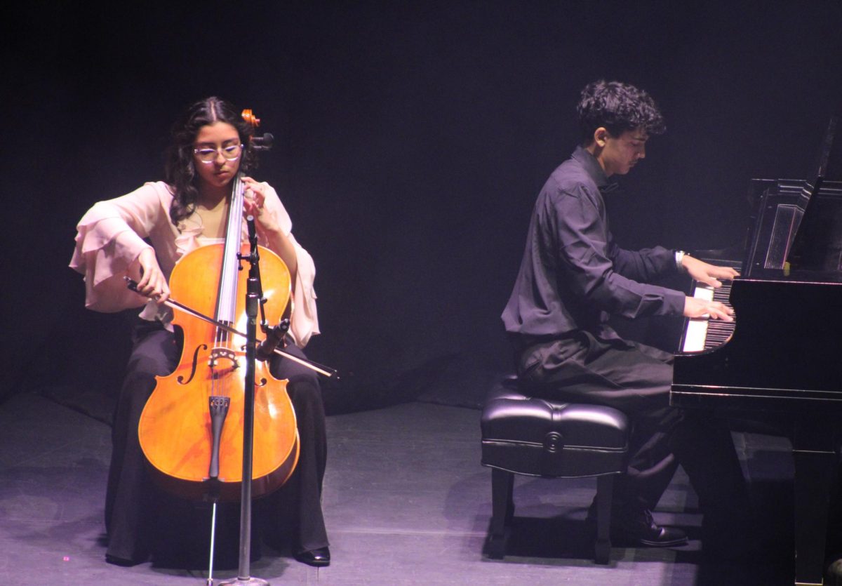 The duo Sofia and Guy perform at the Talent Show. The duo includes Sophia Dona Mata and Ephraim Roundtree. 